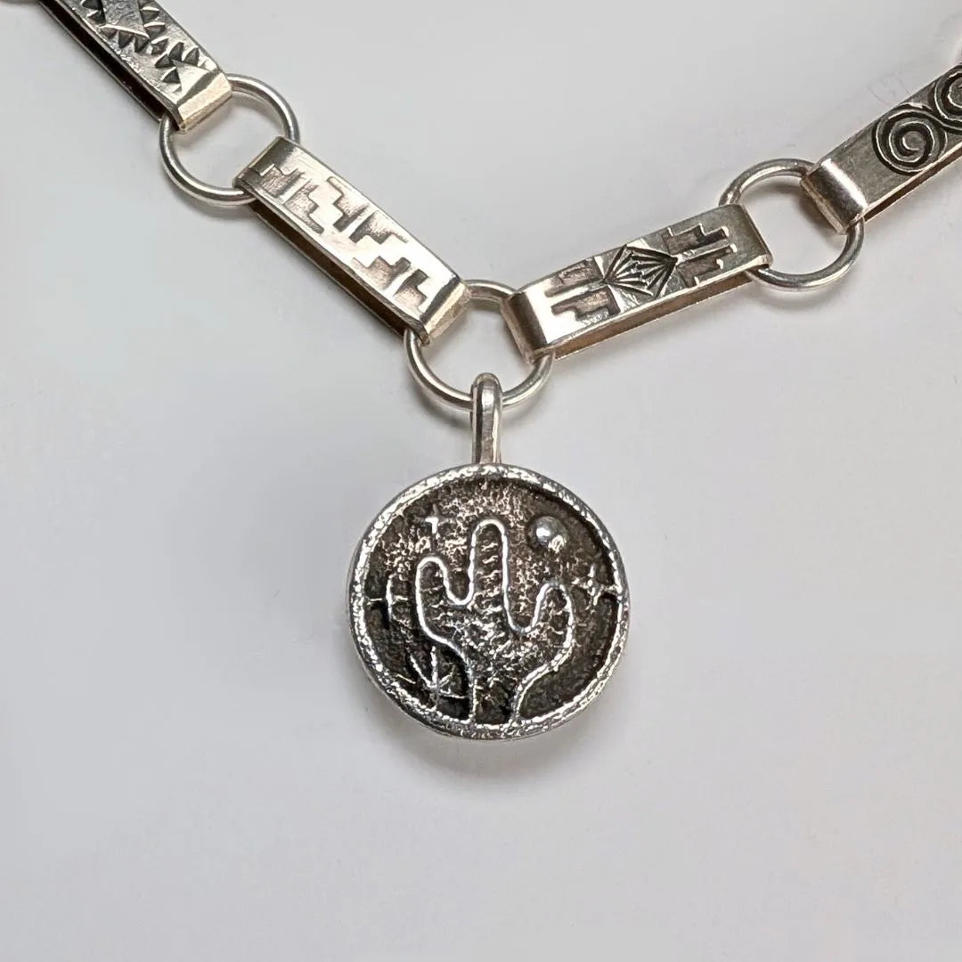 "Cactus Desert Night" Sterling Silver Charm Pendant with Turquoise. Front view on necklace.